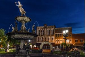 Bowling Green, Kentucky, USA -  The fountain in the town square in historic downtown Bowling Green during blue hour.