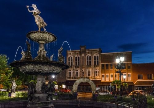 Bowling Green, Kentucky, USA - The fountain in the town square in historic downtown Bowling Green during blue hour.